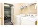 Laundry room with washer, dryer, and additional storage shelving at 441 Montara Dr, Davenport, FL 33897