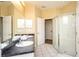 Bathroom with double vanity, shower, and separate tub at 441 Montara Dr, Davenport, FL 33897