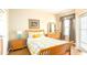 Bedroom with queen bed, floral bedding, and wood floors at 441 Montara Dr, Davenport, FL 33897