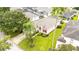 Single-Gathering home with a green lawn and palm trees at 441 Montara Dr, Davenport, FL 33897