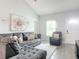 Living room with L-shaped sofa and neutral decor at 1092 Providence Blvd, Deltona, FL 32725