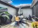 Private patio with outdoor dining set and grill at 1092 Providence Blvd, Deltona, FL 32725