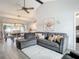 Spacious living room with L-shaped sectional sofa and large TV at 1092 Providence Blvd, Deltona, FL 32725