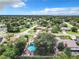 Aerial view showcasing a house, neighborhood, and a distant lake at 1092 Providence Blvd, Deltona, FL 32725