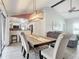 Dining room with farmhouse table and kitchen view at 1092 Providence Blvd, Deltona, FL 32725