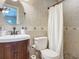 Clean bathroom with a white toilet and shower at 1092 Providence Blvd, Deltona, FL 32725