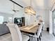 Dining room with farmhouse table and living room view at 1092 Providence Blvd, Deltona, FL 32725