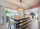 Bright dining room with wooden table and bench seating at 1092 Providence Blvd, Deltona, FL 32725