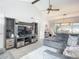 Living room with sectional sofa and entertainment center at 1092 Providence Blvd, Deltona, FL 32725