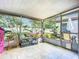Lush screened-in patio overlooking the backyard at 1092 Providence Blvd, Deltona, FL 32725