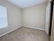 Spacious bedroom with neutral walls, carpet flooring, and a large closet at 16342 Tudor Lake Ct, Orlando, FL 32828