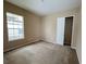 Spacious bedroom with neutral carpeting and a large closet at 16342 Tudor Lake Ct, Orlando, FL 32828