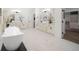 Spa-like bathroom with a large soaking tub, double vanity and walk-in closet at 2820 Jacana Ct, Longwood, FL 32779