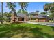 Front view of a two-story brick home with a large yard at 2820 Jacana Ct, Longwood, FL 32779