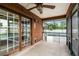 Screened porch with access to pool area and backyard at 1005 Crescent Pkwy, Deland, FL 32724