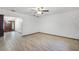 Spacious living room with light walls and wood-look floors at 1005 Crescent Pkwy, Deland, FL 32724