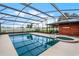 Large, screened pool with spa and plenty of space for relaxation at 1005 Crescent Pkwy, Deland, FL 32724