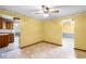 Dining area with yellow walls and wood-look floors at 1005 Crescent Pkwy, Deland, FL 32724
