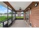 Covered screened porch with ceiling fan, access to backyard at 1005 Crescent Pkwy, Deland, FL 32724