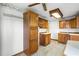 Kitchen with wood cabinets, ample counter space, and a view to dining area at 1005 Crescent Pkwy, Deland, FL 32724