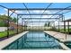Relaxing screened pool and spa, perfect for outdoor enjoyment at 1005 Crescent Pkwy, Deland, FL 32724