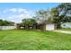 Brick house with a large front yard and a driveway at 1005 Crescent Pkwy, Deland, FL 32724