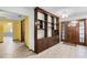 Entryway with built-in shelves and wood floors at 1005 Crescent Pkwy, Deland, FL 32724