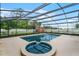 Inviting screened pool and spa; great for entertaining at 1005 Crescent Pkwy, Deland, FL 32724