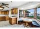 Kitchen boasts wood cabinets, a corner dinette, and backyard views at 1005 Crescent Pkwy, Deland, FL 32724