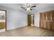 Bedroom with wood floors and built-in closet at 1005 Crescent Pkwy, Deland, FL 32724