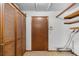 Laundry area with wood cabinets and shelving at 1005 Crescent Pkwy, Deland, FL 32724