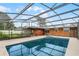 Spacious screened pool and spa, perfect for summer fun at 1005 Crescent Pkwy, Deland, FL 32724
