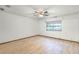 Simple bedroom with wood-look floors and a window at 1005 Crescent Pkwy, Deland, FL 32724