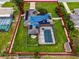 Aerial view showing home with pool, large backyard, and solar panels at 1005 Crescent Pkwy, Deland, FL 32724