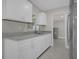 Modern kitchen with white cabinets and granite countertops at 3133 Bon Air Dr, Orlando, FL 32818