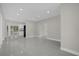 Open living area with tile flooring and access to other rooms at 3133 Bon Air Dr, Orlando, FL 32818
