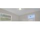 Bedroom with neutral walls and two windows at 3133 Bon Air Dr, Orlando, FL 32818