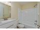 Clean bathroom with white subway tile and vanity with a granite countertop at 4806 S Semoran Blvd # 201, Orlando, FL 32822