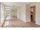 Bright dining area with mirrored accent wall and hardwood floors at 4806 S Semoran Blvd # 201, Orlando, FL 32822