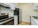 Clean and efficient kitchen featuring stainless steel appliances at 4806 S Semoran Blvd # 201, Orlando, FL 32822