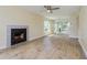 Spacious living room with mirrored wall and wood-look floors at 4806 S Semoran Blvd # 201, Orlando, FL 32822