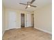 Spacious bedroom with light wood flooring and ceiling fan at 4806 S Semoran Blvd # 201, Orlando, FL 32822