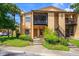 Inviting condo exterior with landscaping and parking at 4806 S Semoran Blvd # 201, Orlando, FL 32822