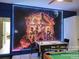 Game room with air hockey, pool table, and Avengers mural at 2615 Emerald Island Blvd, Kissimmee, FL 34747