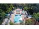 Community pool with plenty of lounge chairs at 2615 Emerald Island Blvd, Kissimmee, FL 34747