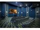 Relax in this home theater with comfortable seating at 791 Pebble Beach Dr, Davenport, FL 33896