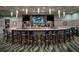 Relax and unwind at the community bar featuring a large seating area at 791 Pebble Beach Dr, Davenport, FL 33896