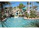 Cool off in the community pool featuring a waterslide at 791 Pebble Beach Dr, Davenport, FL 33896