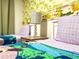 Twin bedroom with animal-themed bedding and border at 791 Pebble Beach Dr, Davenport, FL 33896