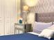 Serene bedroom with a plush bed and mirrored nightstand at 791 Pebble Beach Dr, Davenport, FL 33896